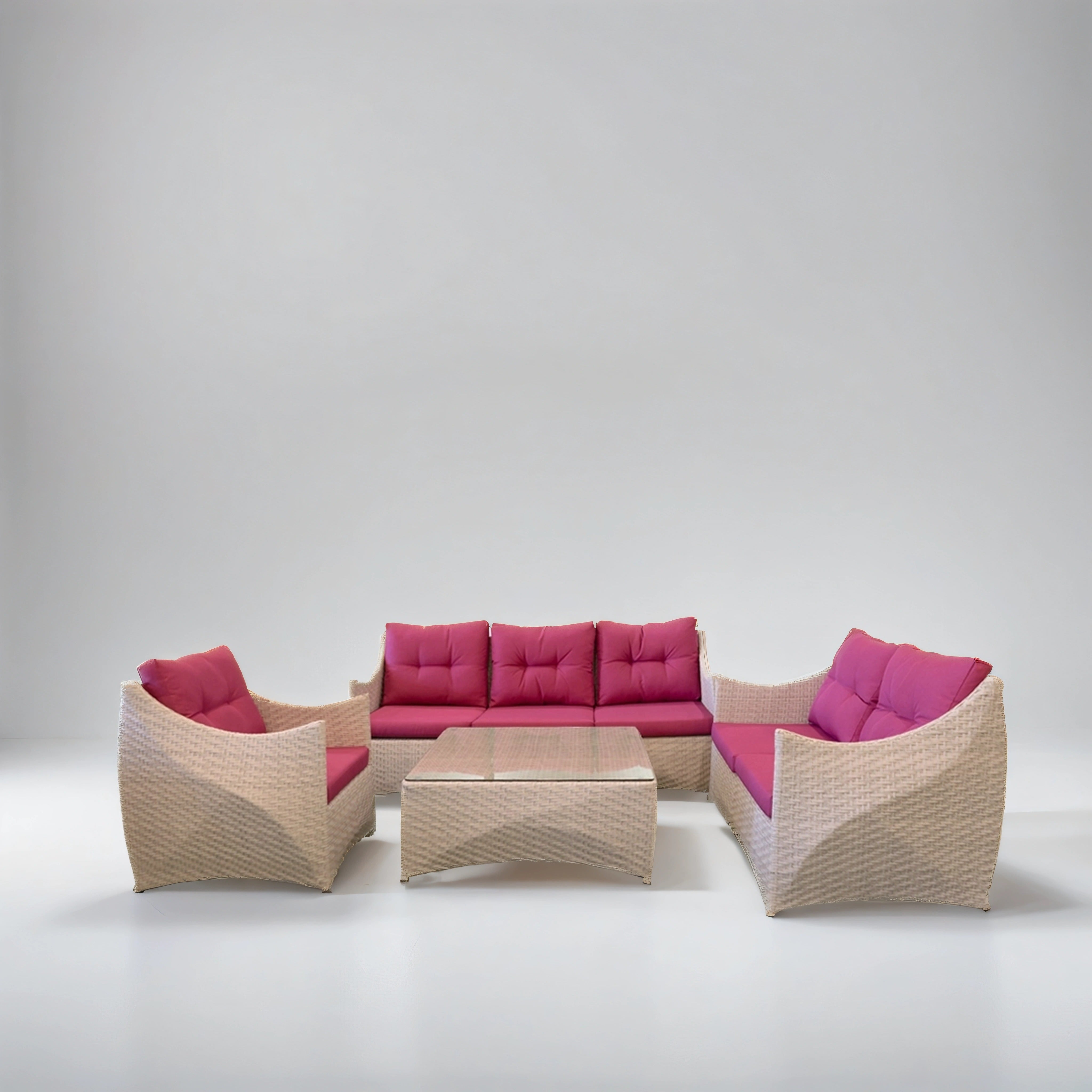 Pink and white rattan lounge set with two tables
